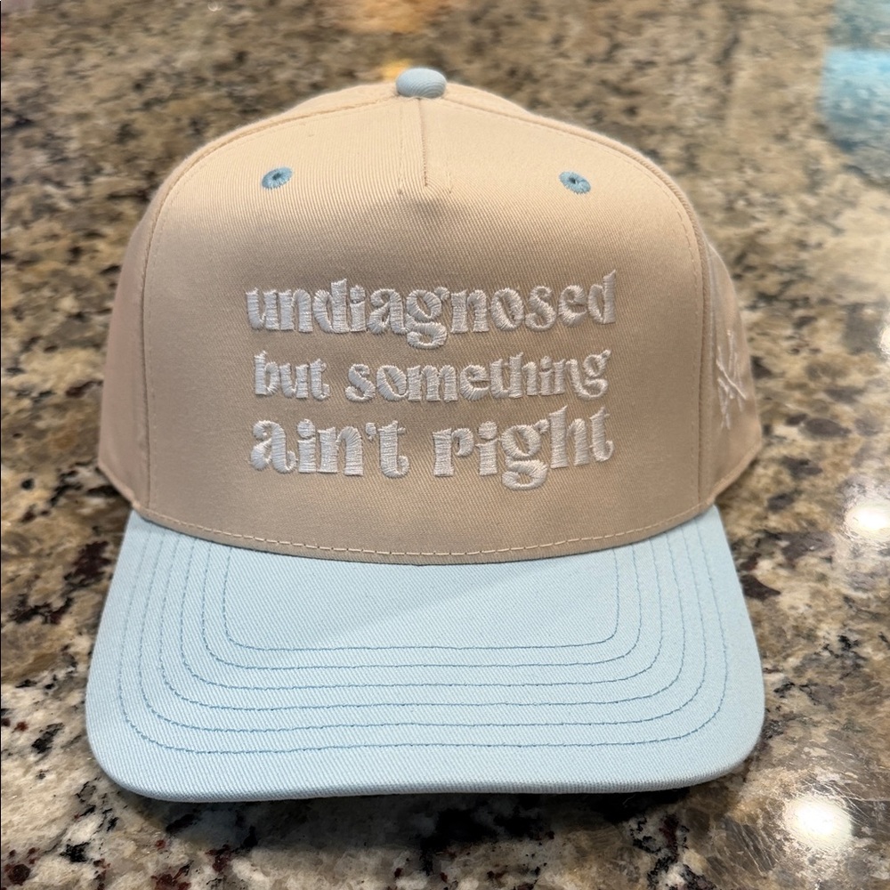 Undiagnosed But Something Ain't Right Beige and Light Blue Baseball Cap